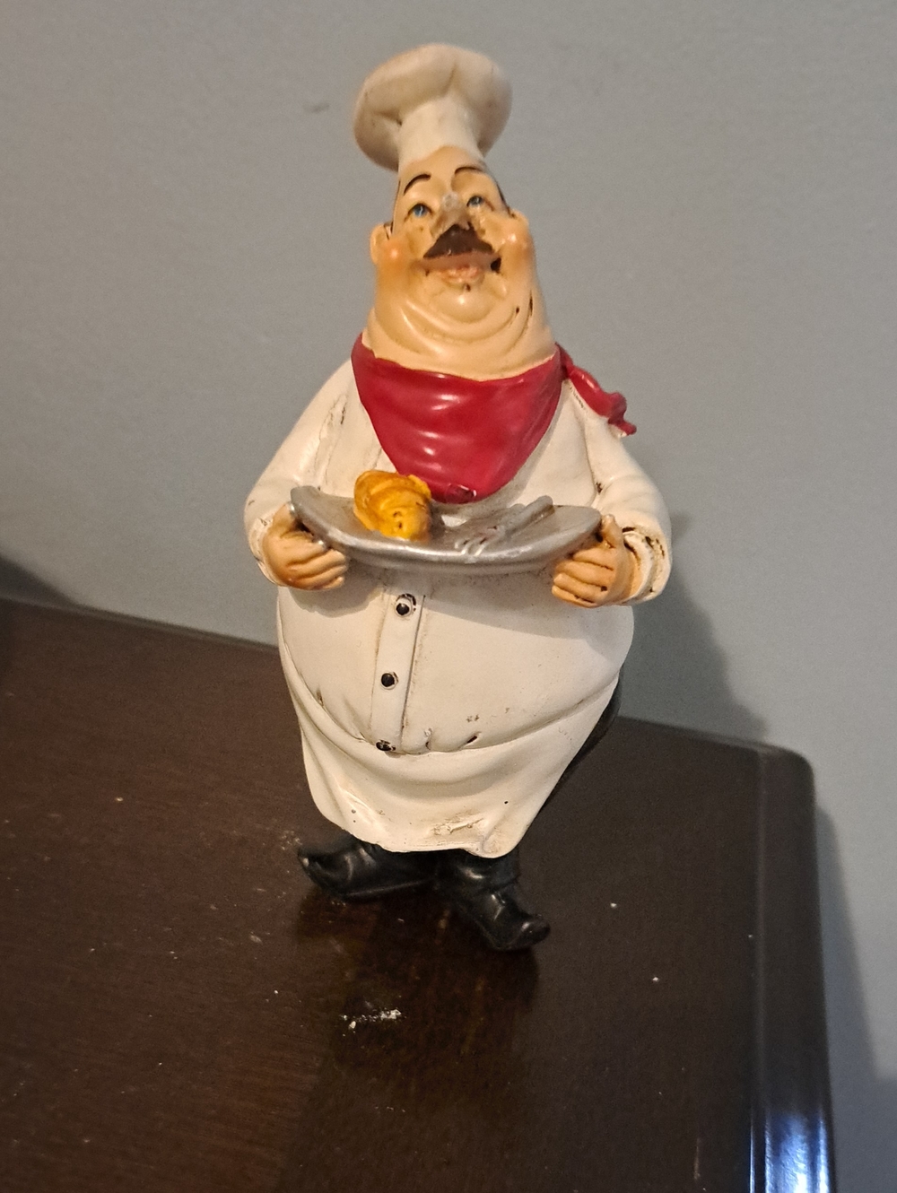 Chef Figurine with Red Scarf Holding Plate